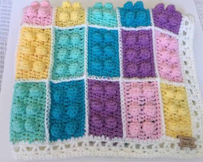 il_fullxfull.1353919835_m089 Pastel LEGO-inspired crochet block blanket with textured brick squares