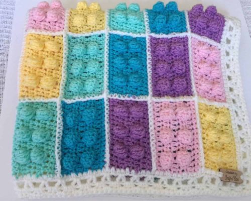 il_fullxfull.1353919835_m089 Pastel LEGO-inspired crochet block blanket with textured brick squares